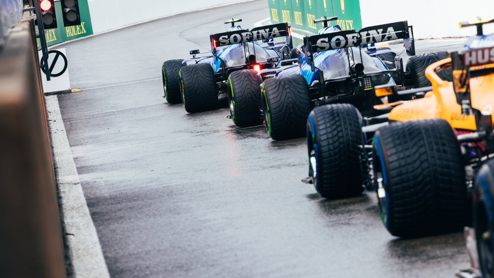 Nicholas Latifi (CDN) Williams Racing FW43B and George Russell (GBR) Williams Racing FW43B at the pit lane exit.